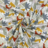 A swivel of fabric featuring a geometric pattern with a variety of colors including gray, brown, black, yellow, and orange.